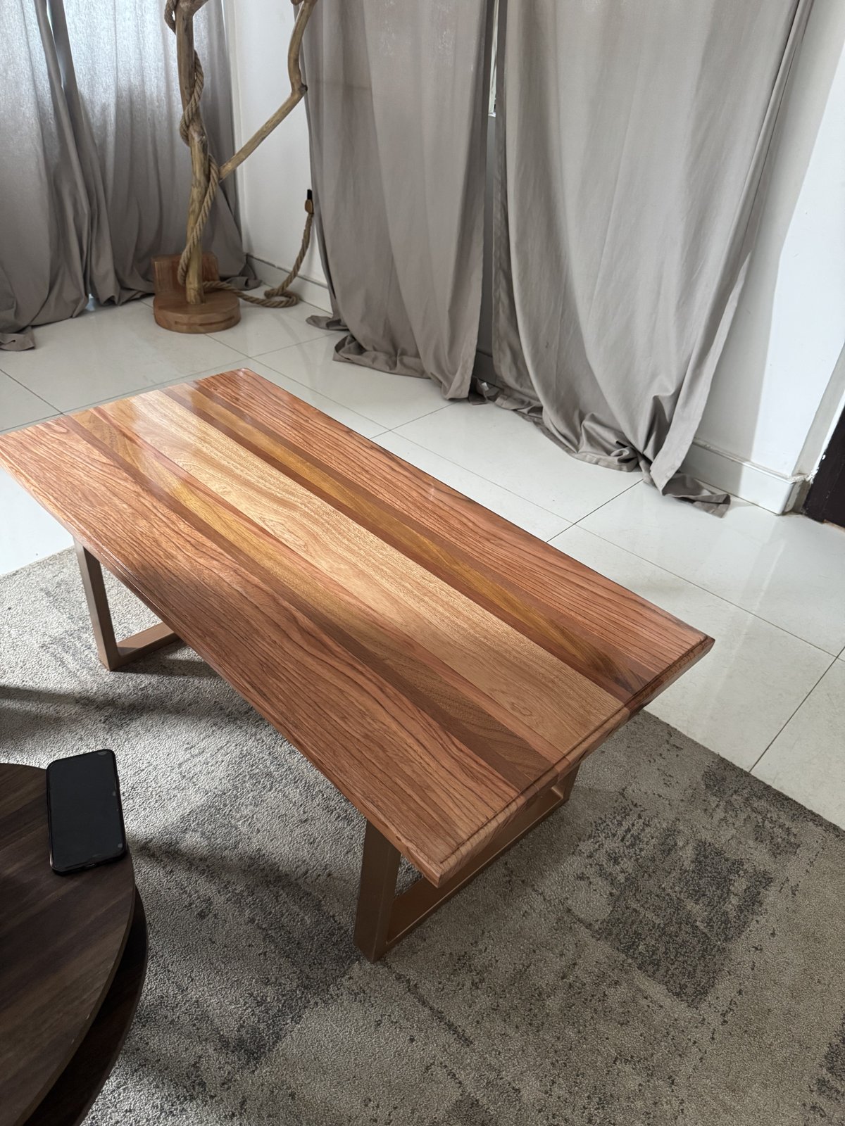 Centre Table — A solid hardwood centre table with a high-gloss finish.